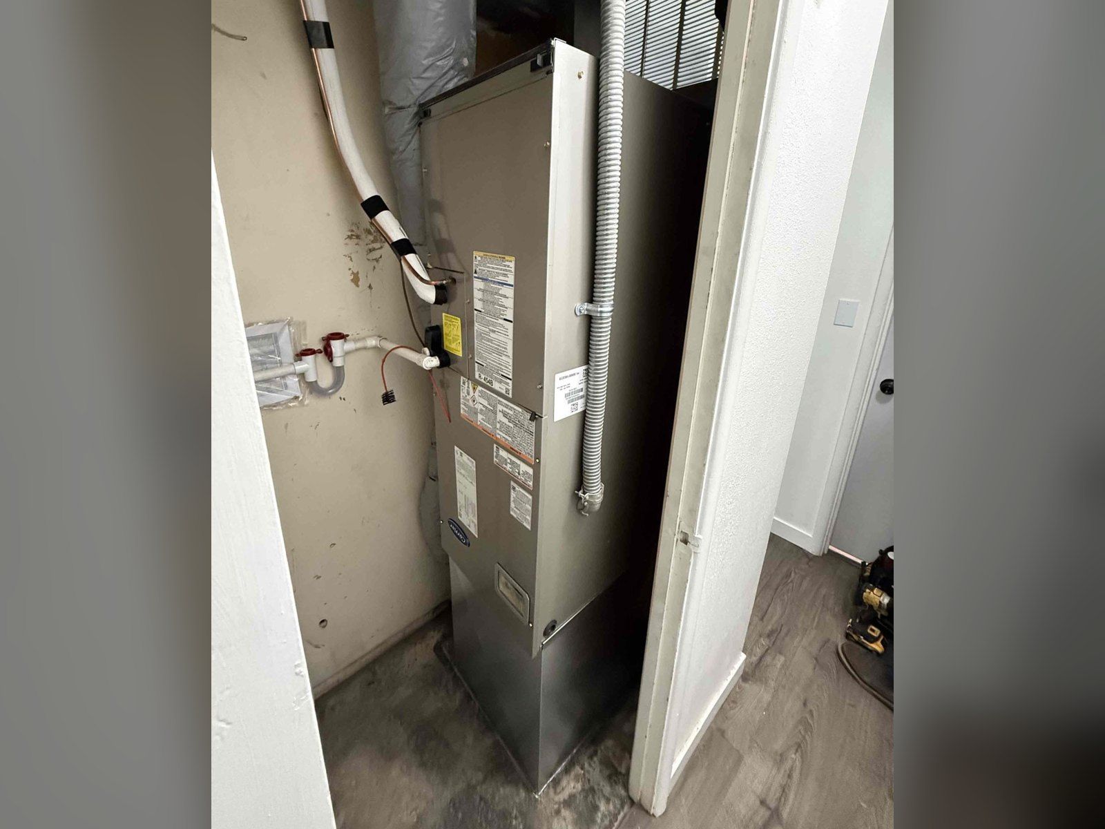New Carrier air handler installed by Alpine Aire in a closet in a Wenatchee, WA home