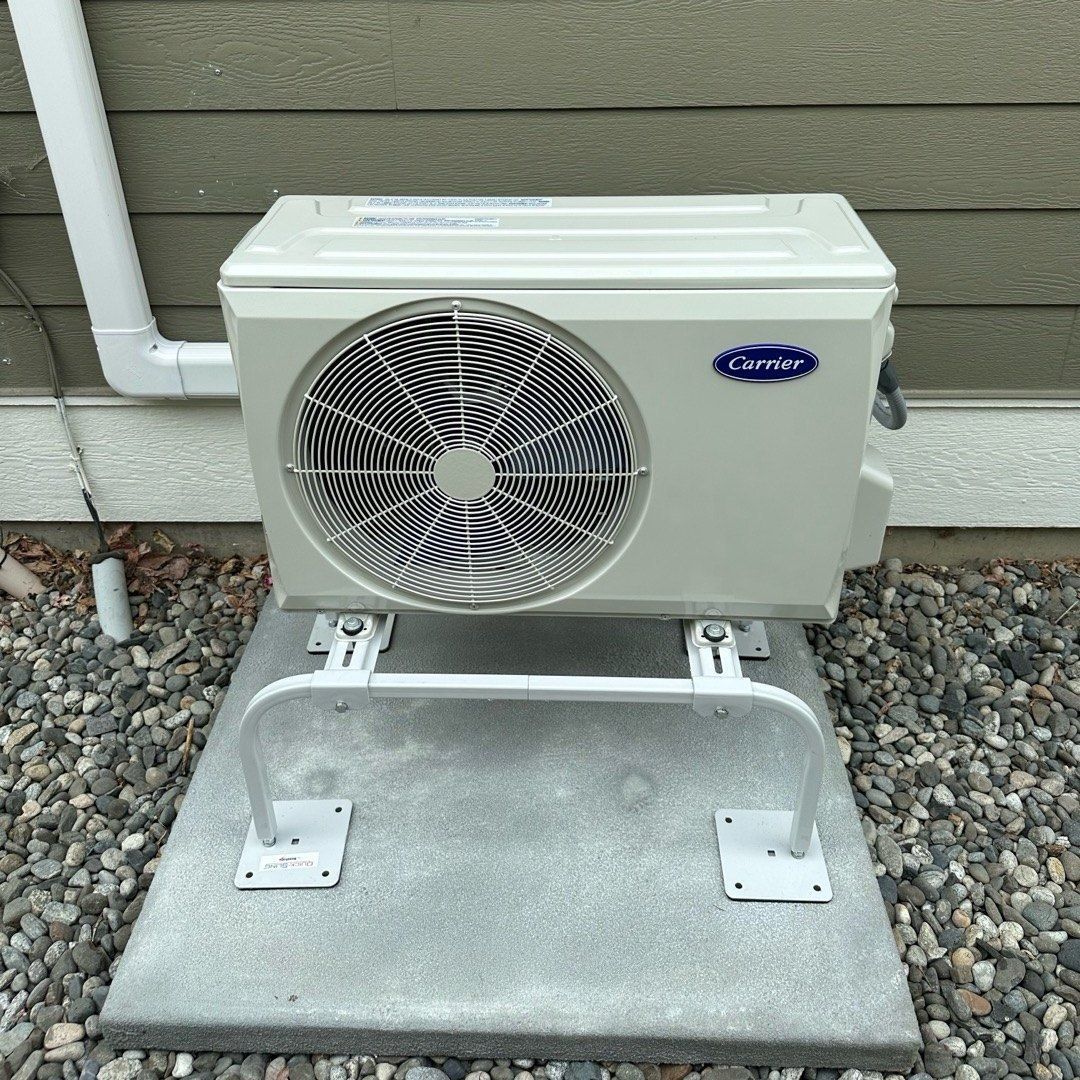 Carrier ductless mini-split outdoor unit with covered line set, installed by Alpine Aire in Wenatchee, WA