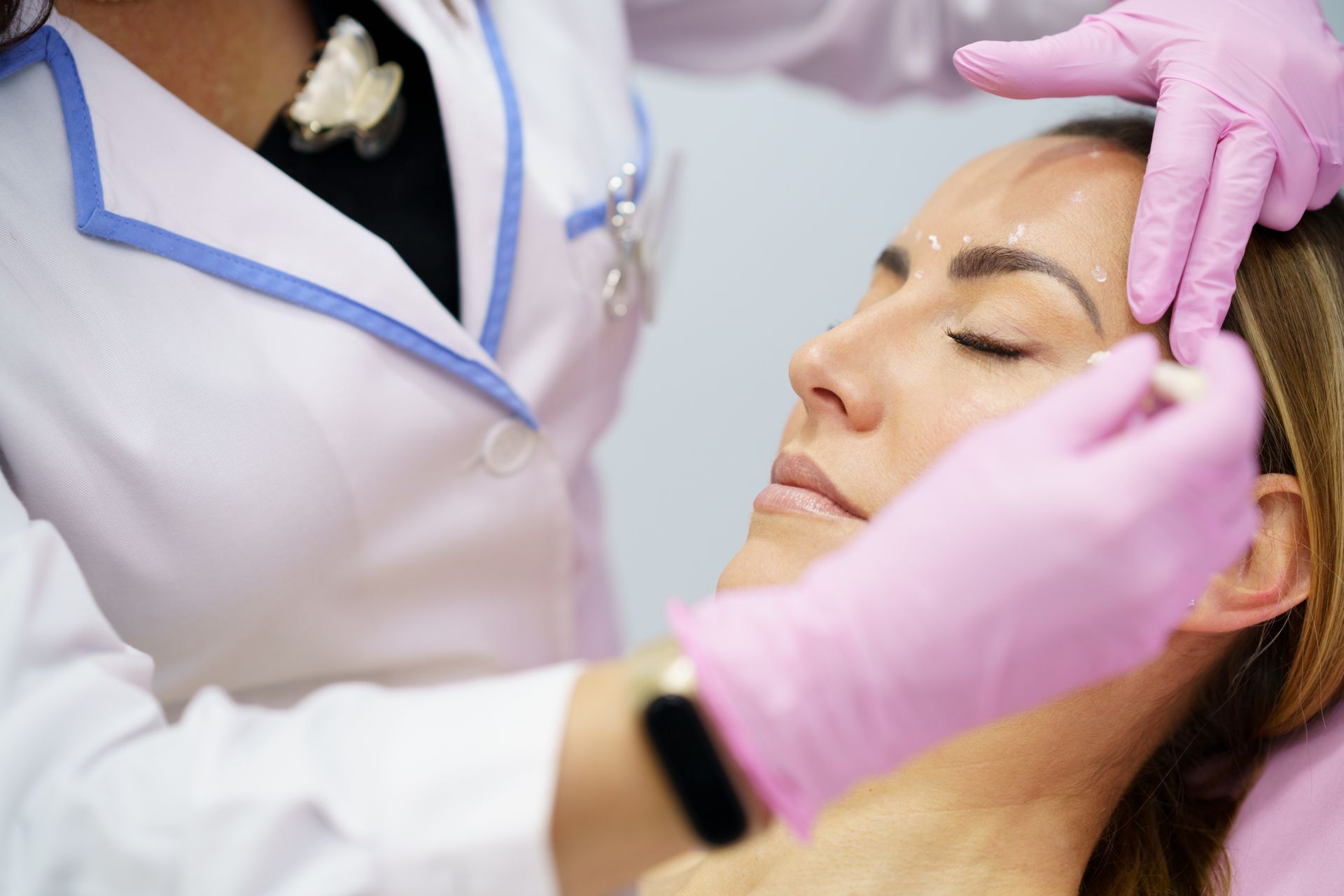 Woman receiving injection treatments