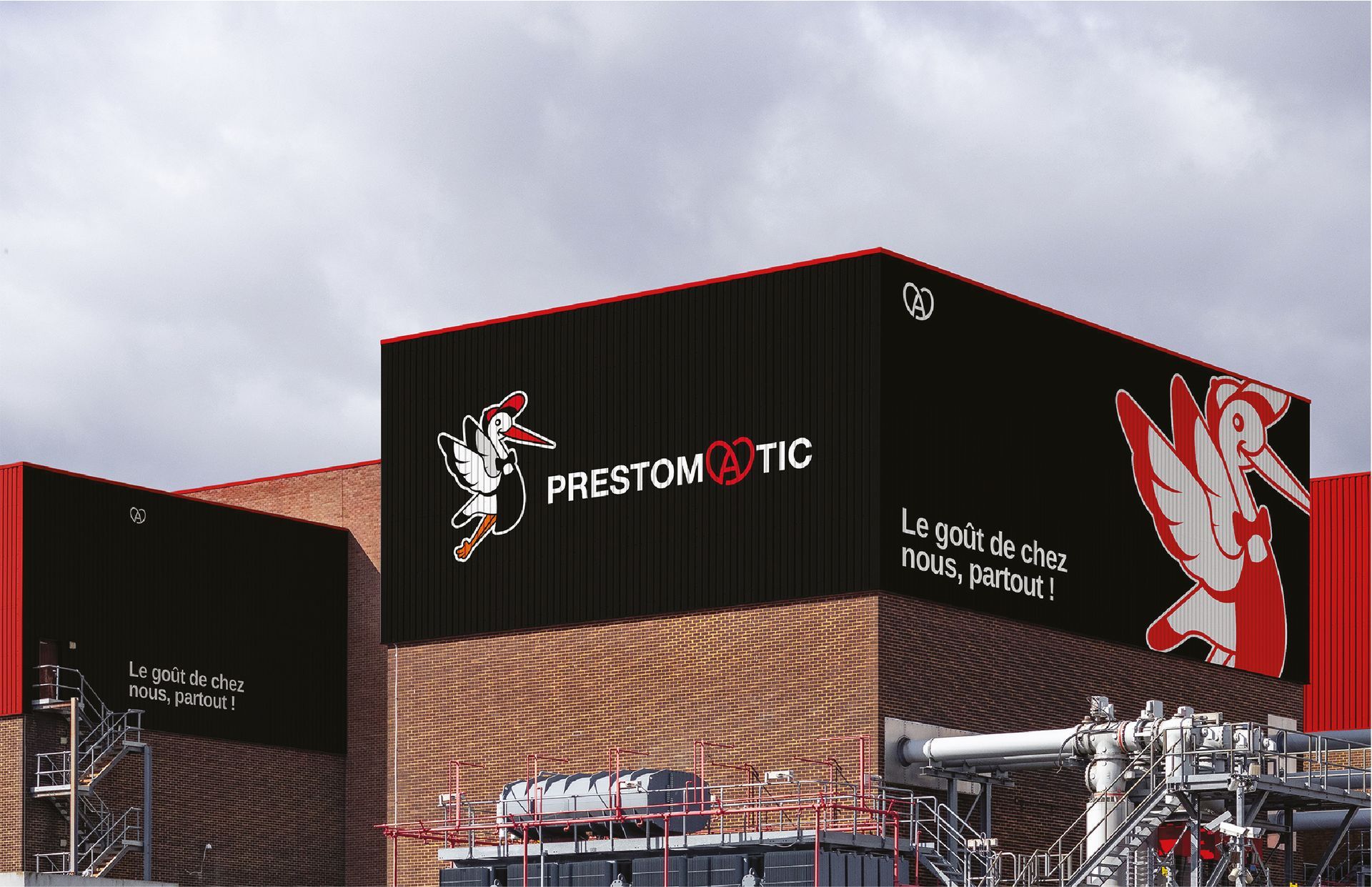 Bâtiment industriel noir avec des finitions et un logo rouges : « Priestomatic ».