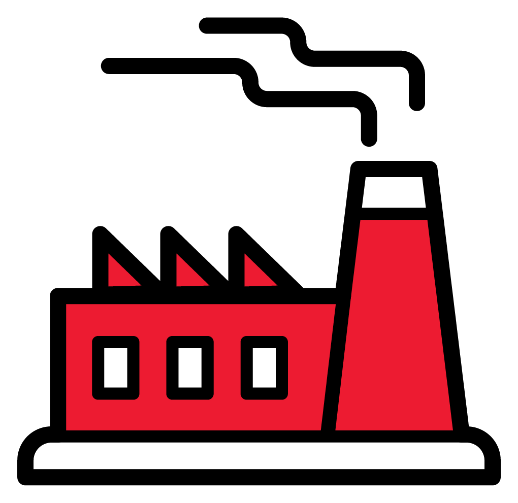 Usine rouge d'où s'échappe une épaisse fumée de sa cheminée.