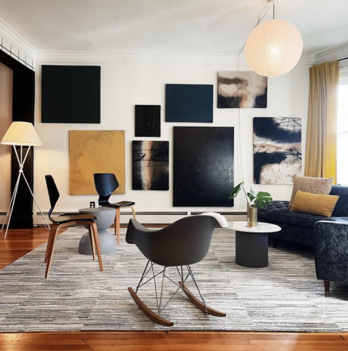 A living room with a rocking chair and a couch