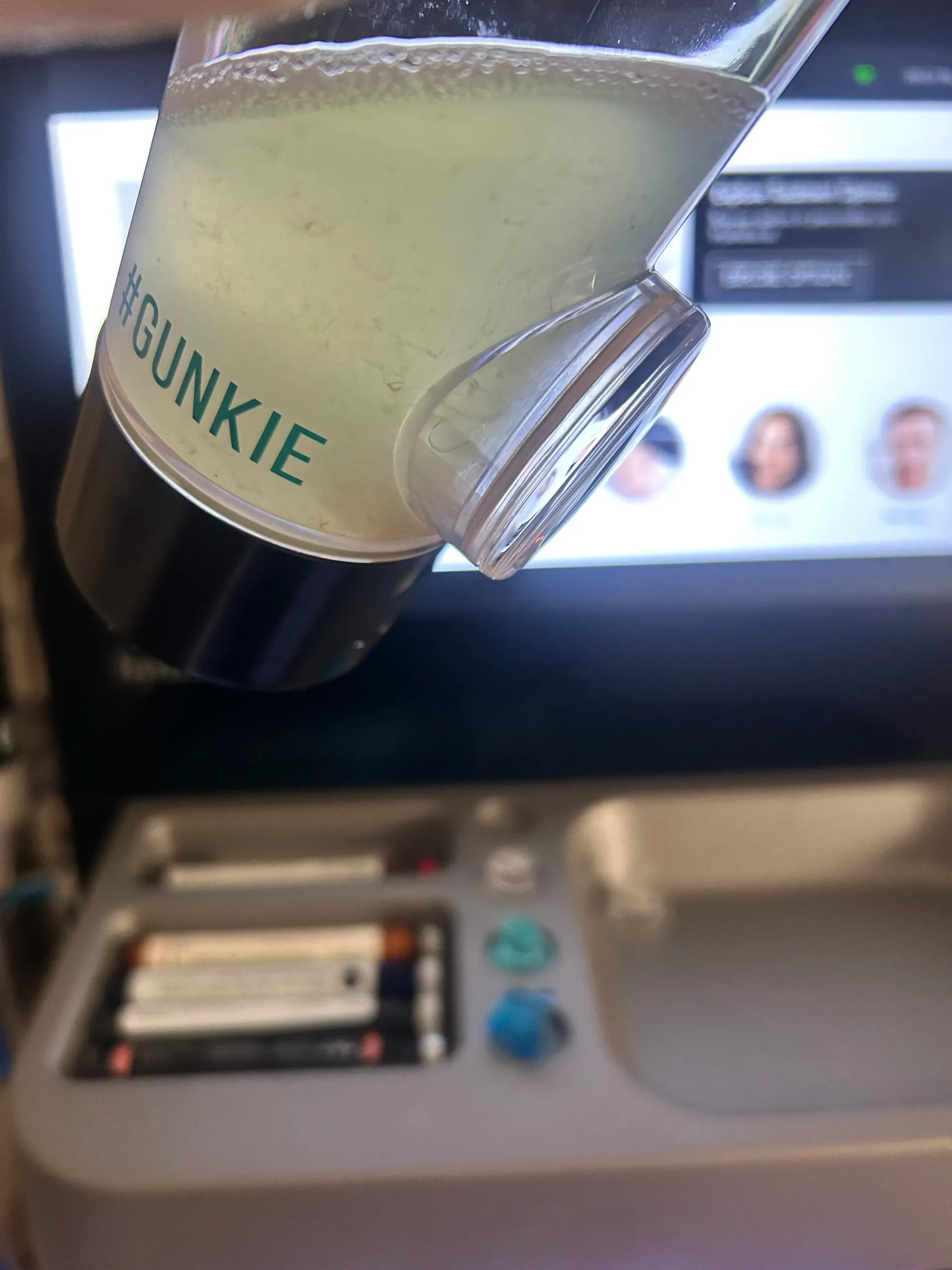 HydraFacial Syndeo Gunkie cup showing debris removed during painless extractions at Spa La La Tampa