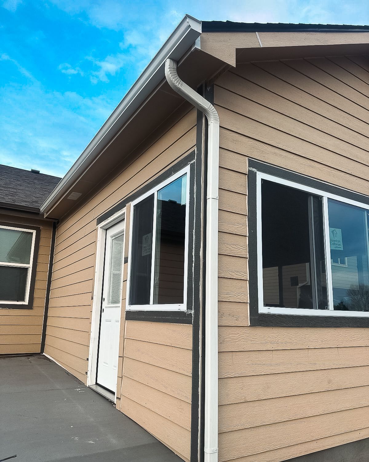 A house with a gutter on the side of it