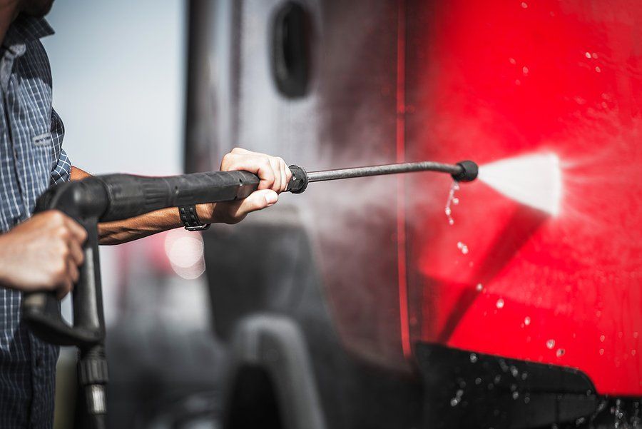 Contractor washing semi truck
