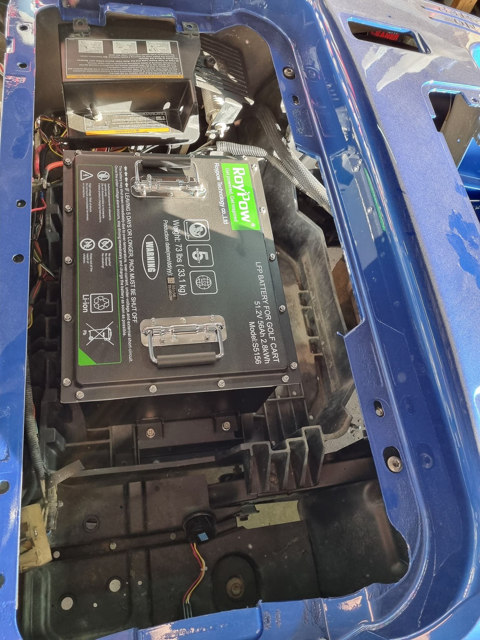 Blue Vehicle Compartment With a Dayflow Battery Pack and Electrical Components — Orange Auto Electrics in Orange, NSW