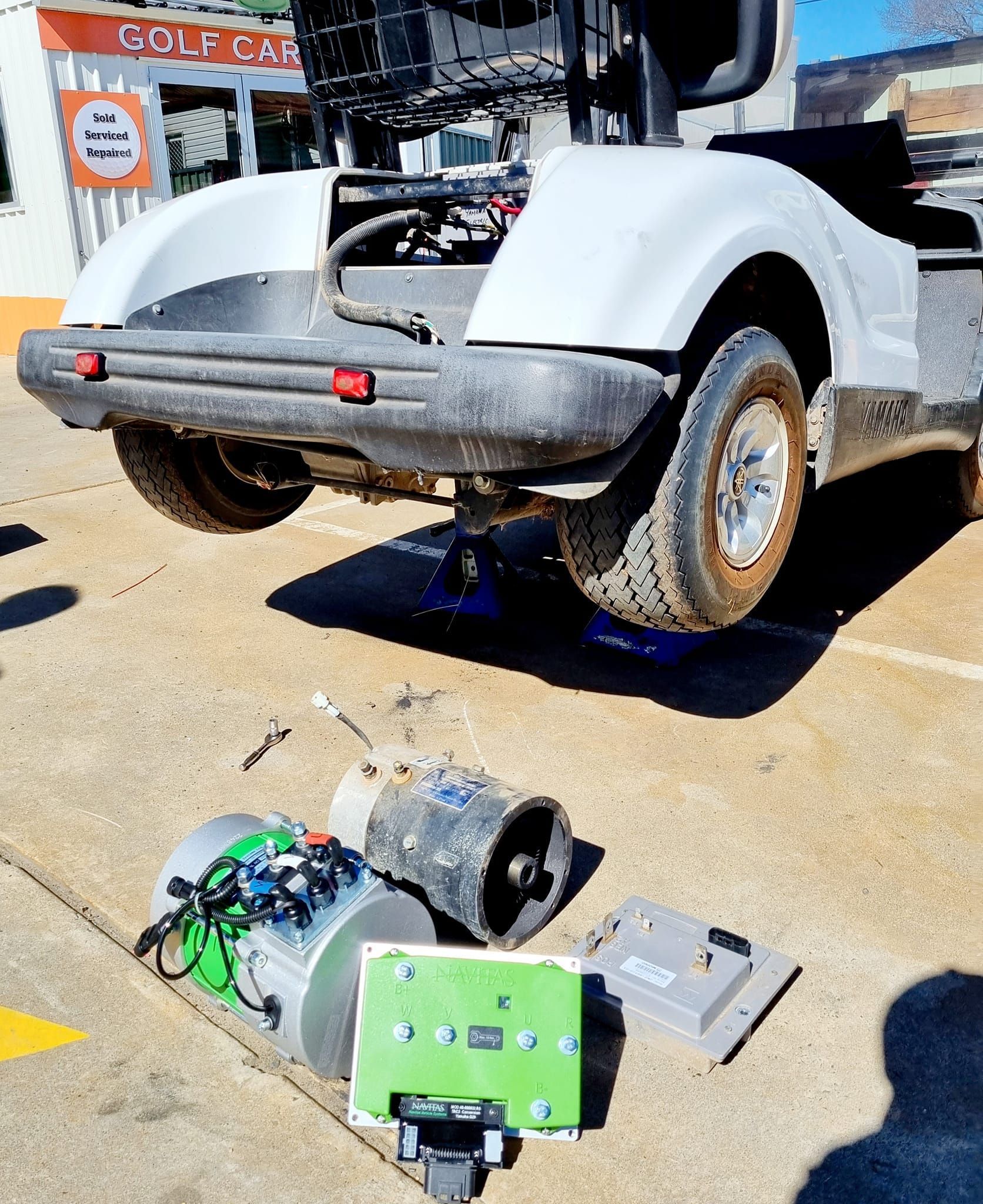 Golf Cart Undergoing Repair, Rear End Lifted — Orange Auto Electrics in Orange, NSW