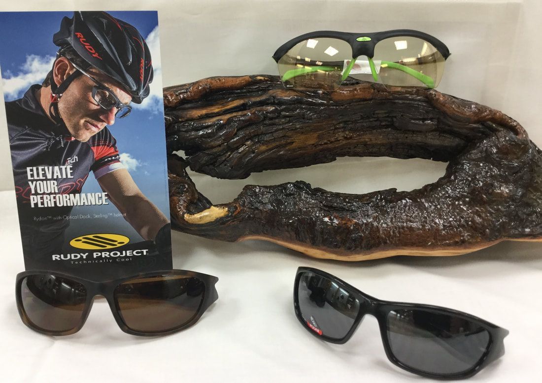 A picture of a man wearing a helmet next to a pair of sunglasses