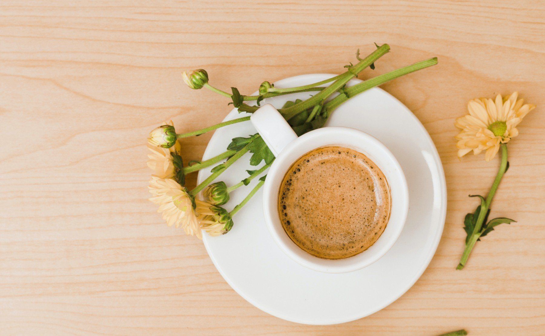 Cup of coffee with flowers