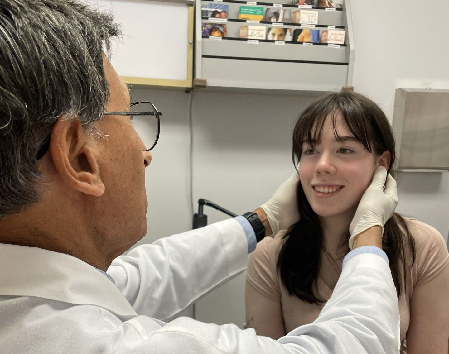 Facial Reconstructive Surgery — Cosmetic Surgeon Examines Face in Pottsville, PA