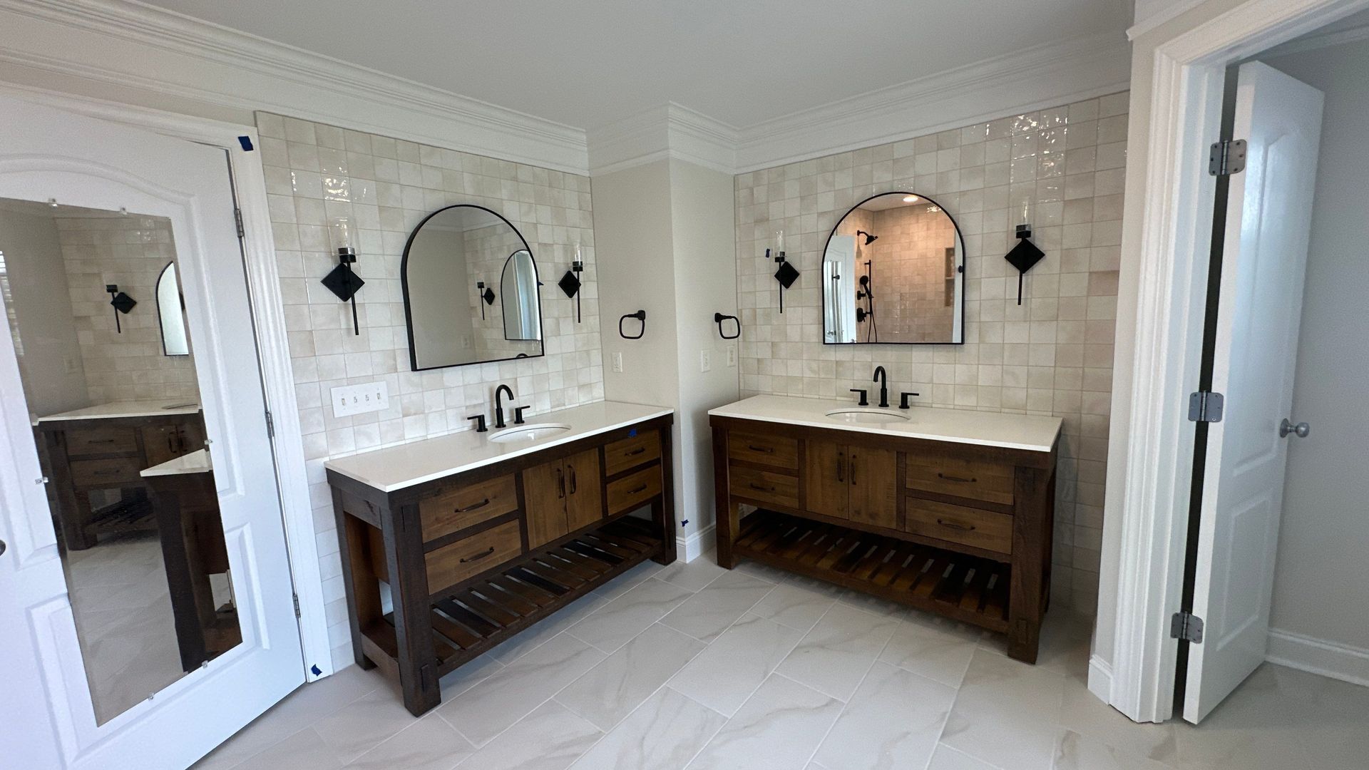 Franklin TN bathroom remodel with his and hers vanities, new tiling and custom fixturesw
