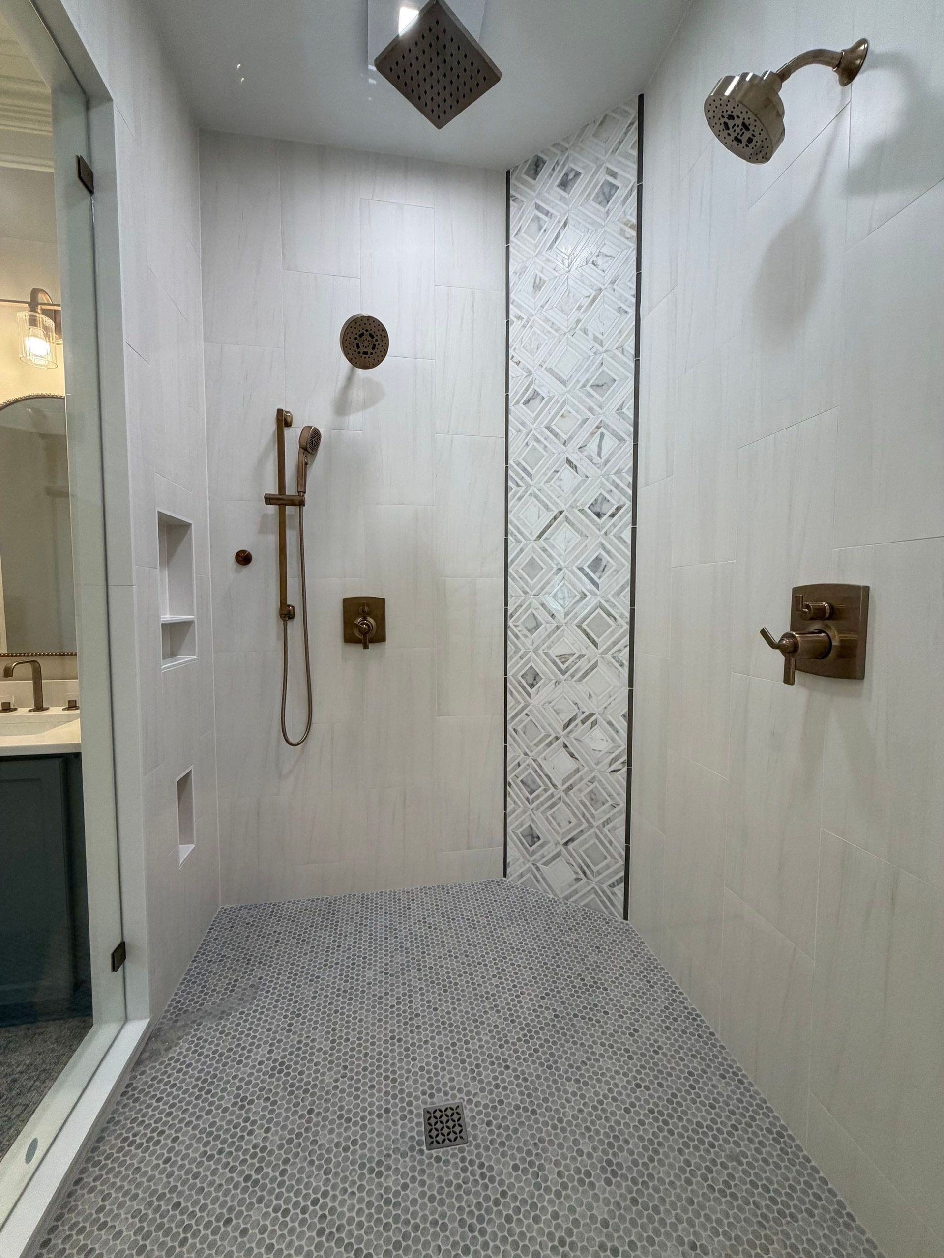Walk in glass shower with custom hardware and tile in Franklin TN