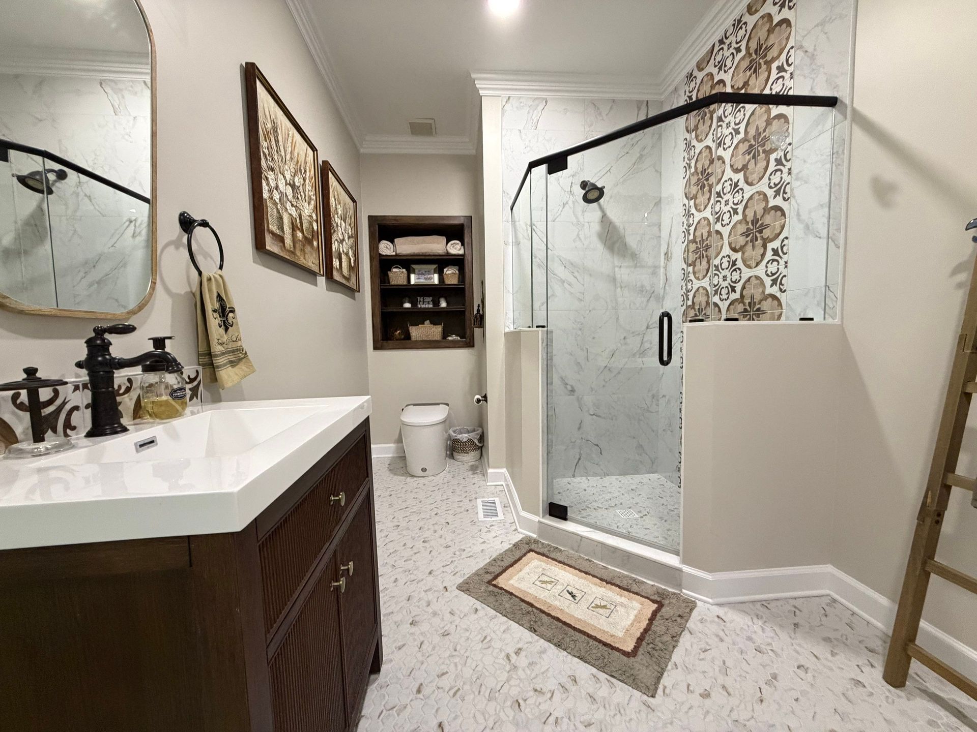 Completely custom bathroom remodel in Brentwood, Tennessee with improved layout, new tiles and fixtures, and glass shower enclosure