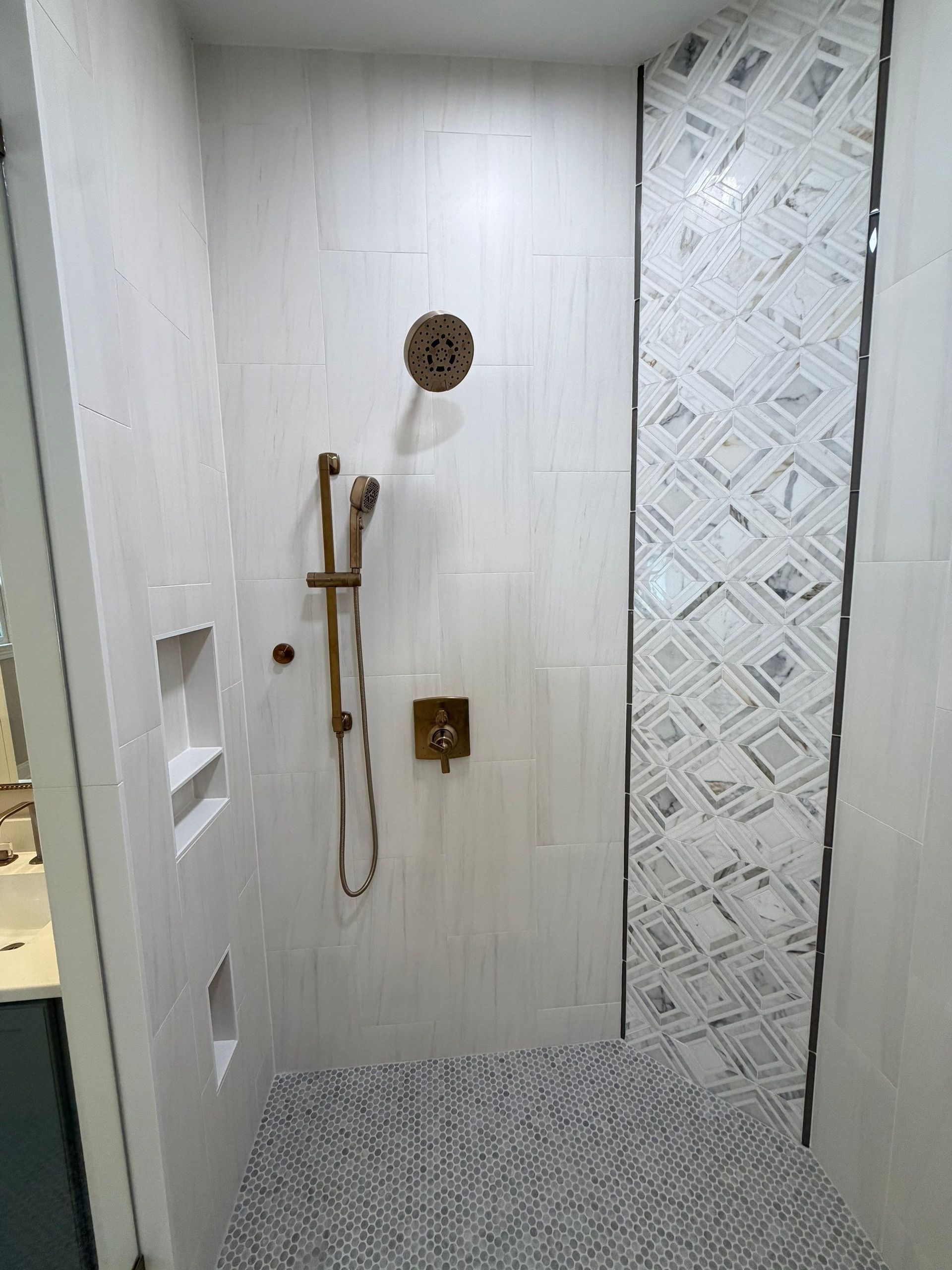 Custom tiling, hardware, lighting and glass shower enclosure in Franklin, Tennessee