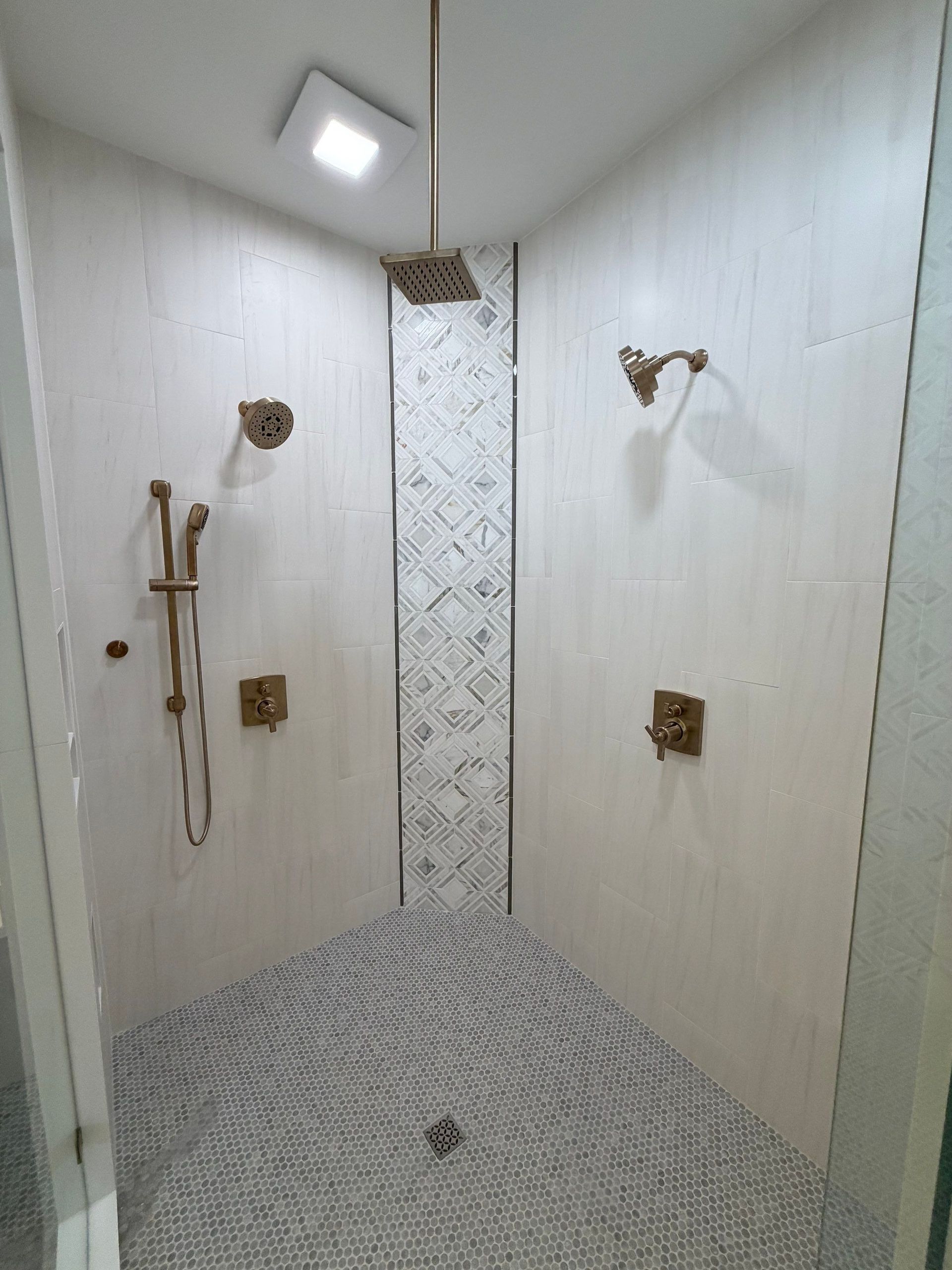 Custom bathroom install in Franklin TN featuring glass shower and custom hardware