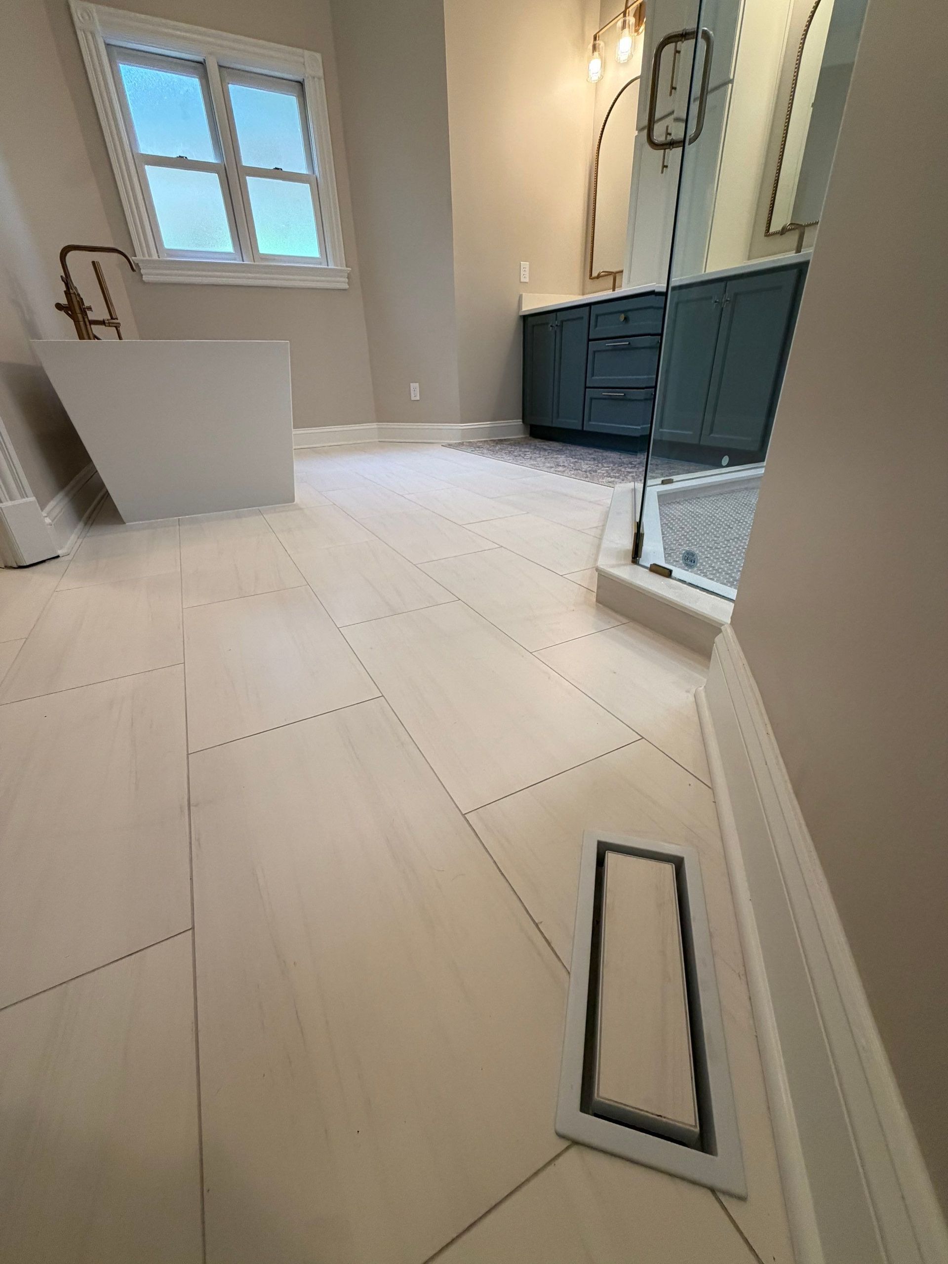 Bathroom remodel with custom tile, hardware, lighting, cabinetry and vanity in Franklin, Tennessee