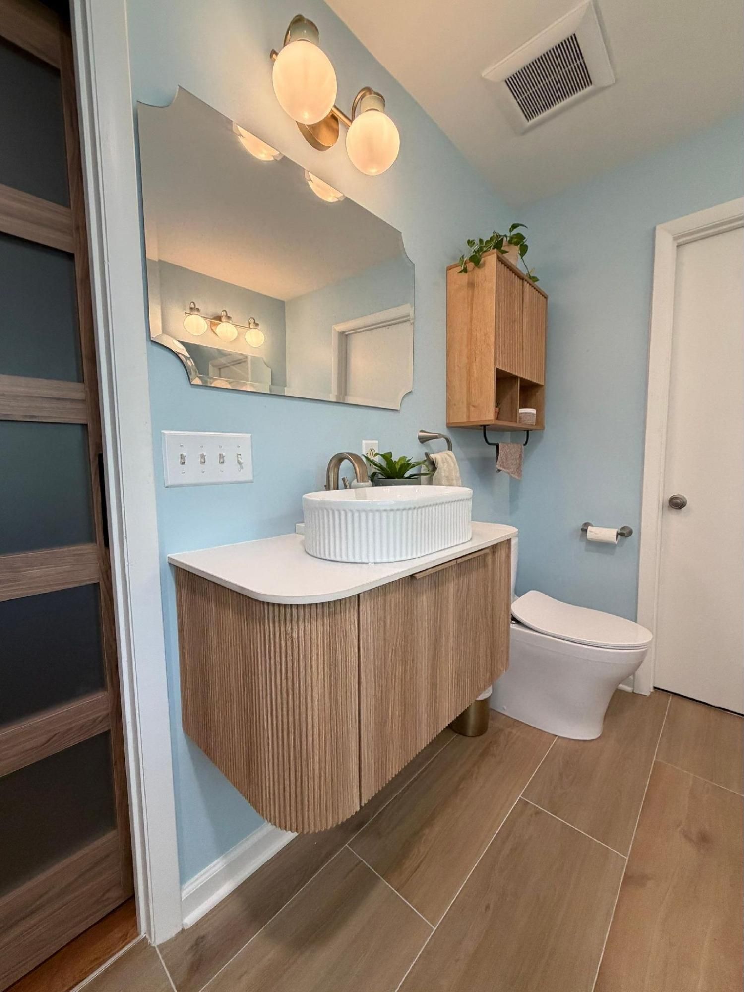 Smart toilet and custom floating vanity in a renovated Nashville TN bathroom