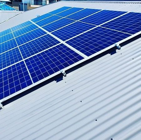 A Row of Blue Solar Panels on a White Roof — Solarblu Pty Ltd in Kangaroo Valley, NSW