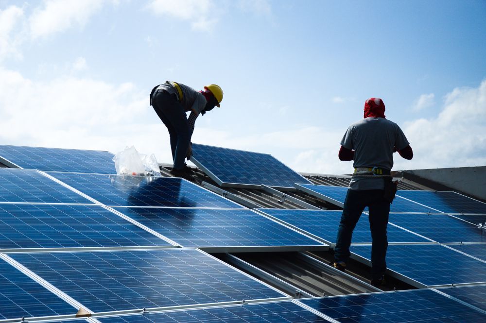 Two Workers Installing Solar Panels