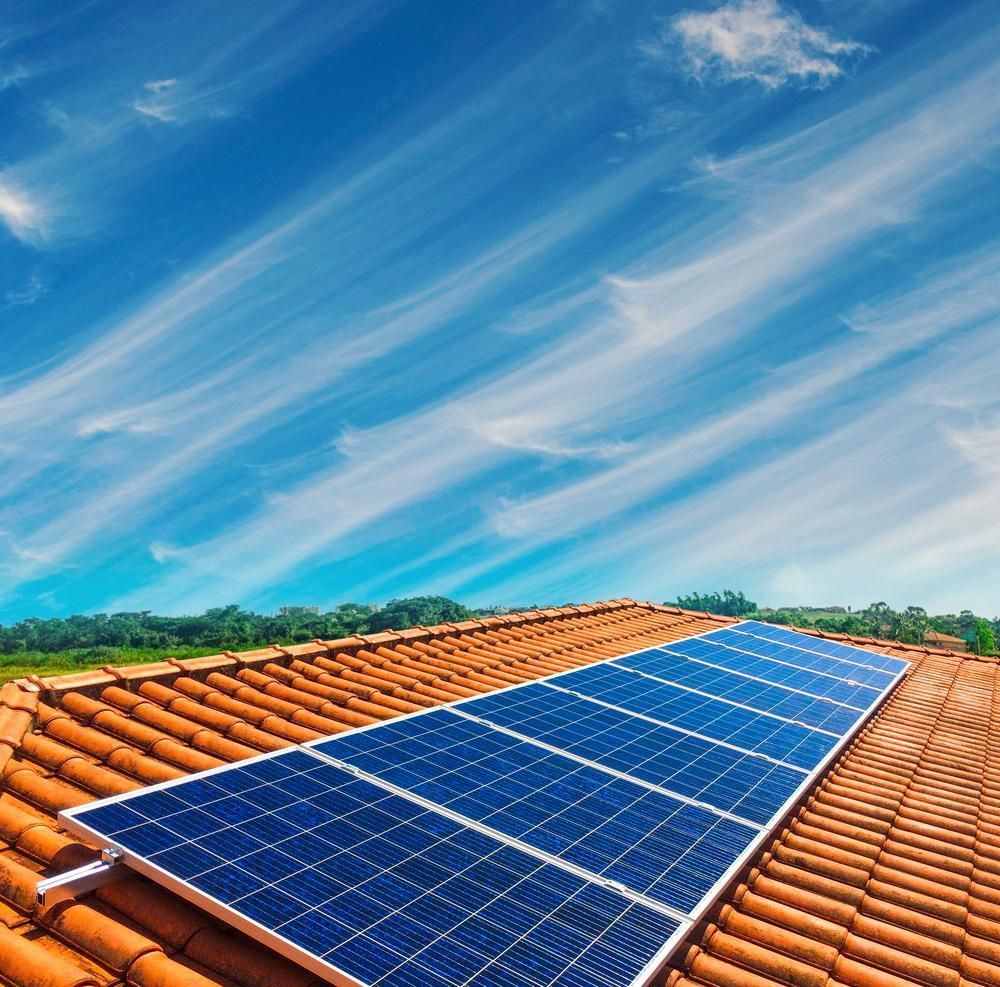 A Row Of Solar Panels On A Tiled Roof — Solarblu Pty Ltd In Moss Vale, NSW