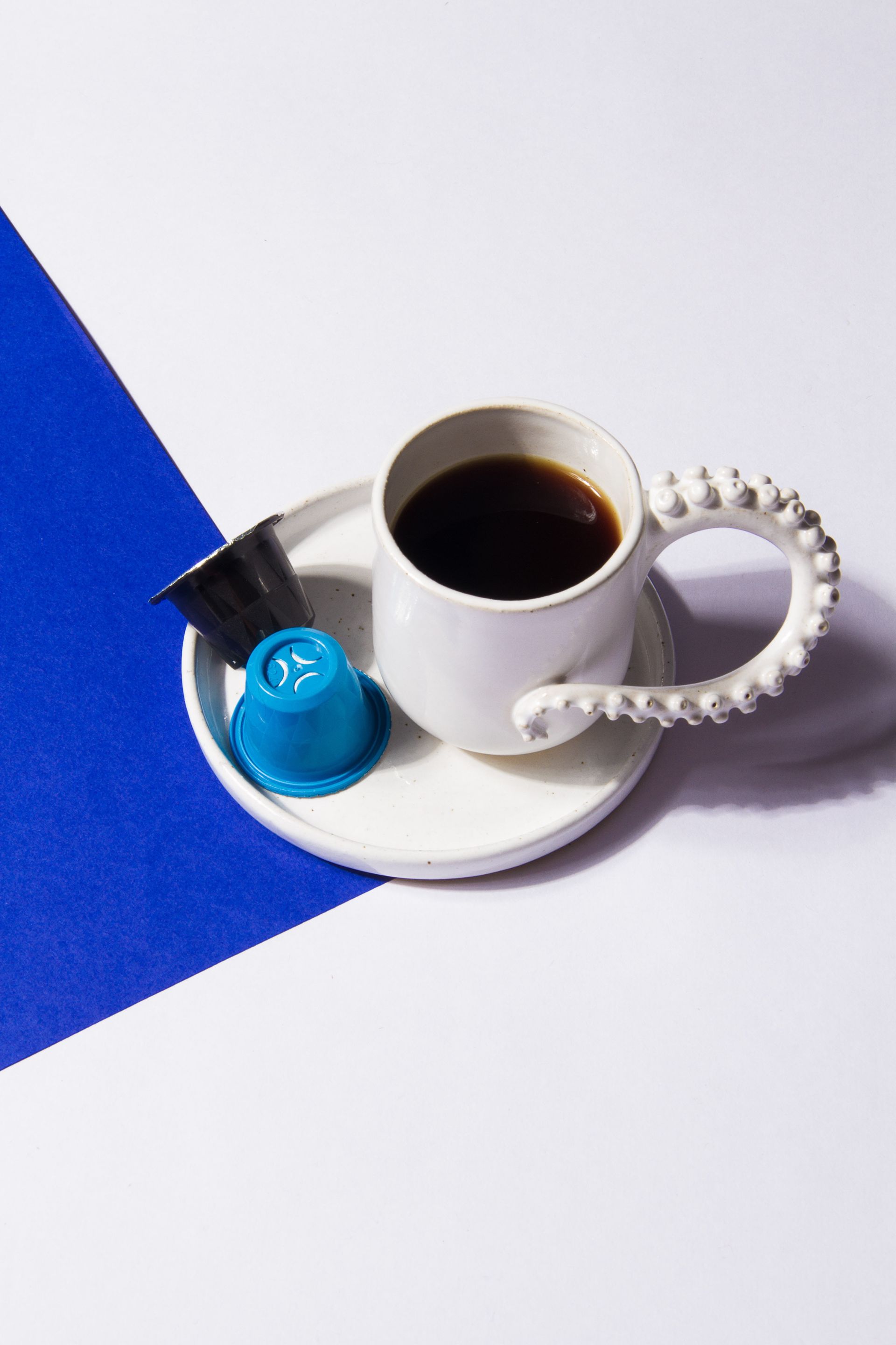 Mug Of Coffee With Coffee Pods
