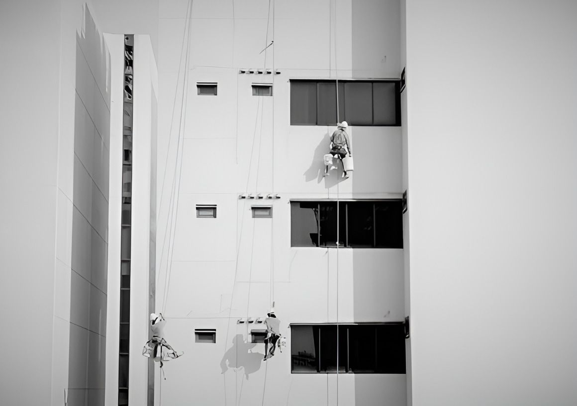 A Group of People Are Painting the Side of a Building — NHM Painting & Projects in Ciccone, NT