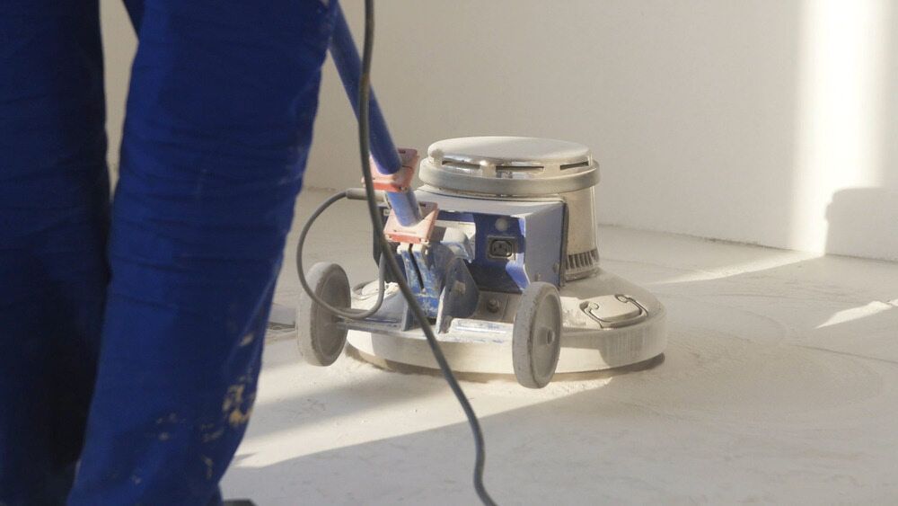 A Person is Using a Machine to Polish the Floor  — NHM Painting & Projects in Ciccone, NT