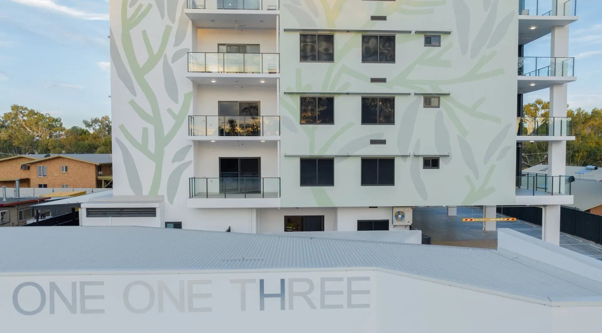 A White Building With the Words One One Three on It  — NHM Painting & Projects in Ciccone, NT