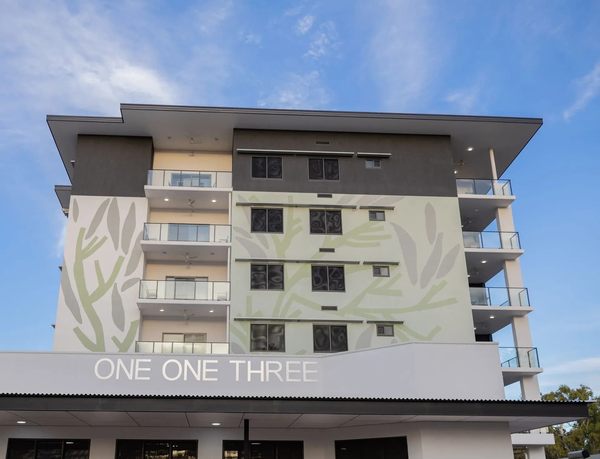 A Large Building With a Sign That Says One One Three  — NHM Painting & Projects in Ciccone, NT