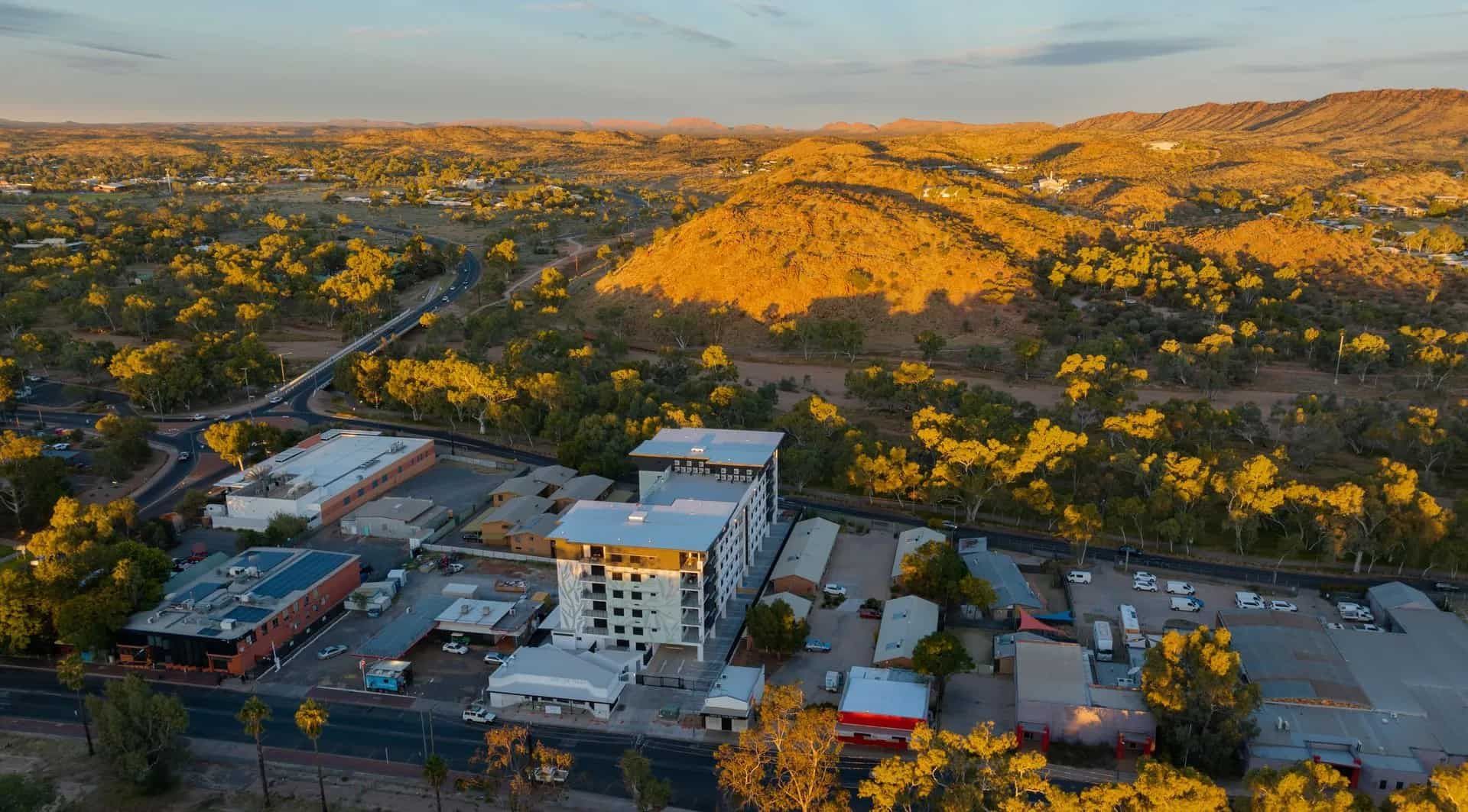 An Aerial View of a City Surrounded by Mountains and Trees  — NHM Painting & Projects in Ciccone, NT