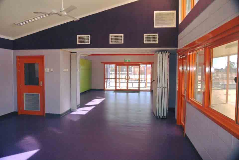 An Empty Room With Purple Walls and Orange Doors  — NHM Painting & Projects in Ciccone, NT