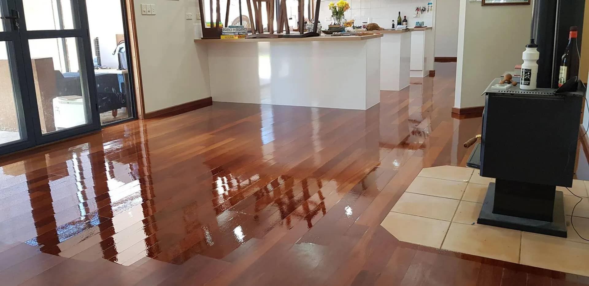 A Living Room With a Wooden Floor and a Fireplace  — NHM Painting & Projects in Ciccone, NT