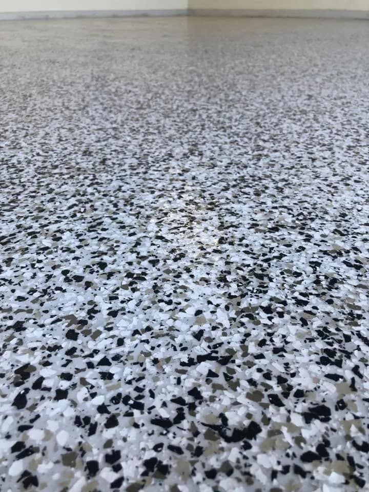 A Close Up of a Black and White Marble Floor in a Garage  — NHM Painting & Projects in Ciccone, NT