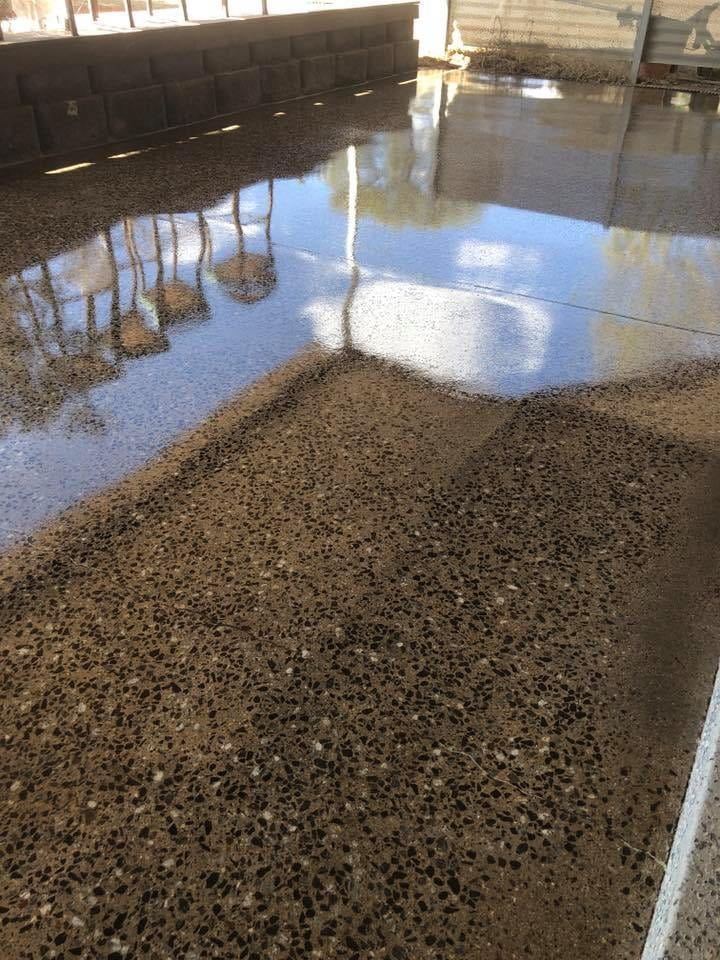 A Concrete Floor With a Lot of Water on It  — NHM Painting & Projects in Ciccone, NT