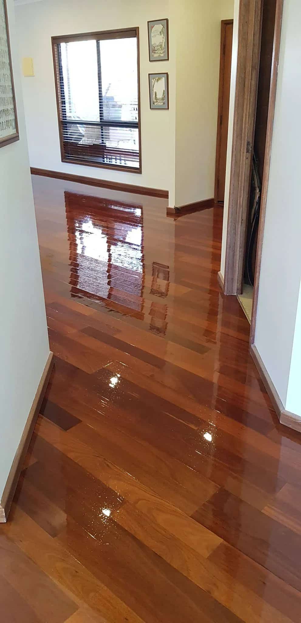 A Hallway With a Wooden Floor and a Mirror  — NHM Painting & Projects in Ciccone, NT