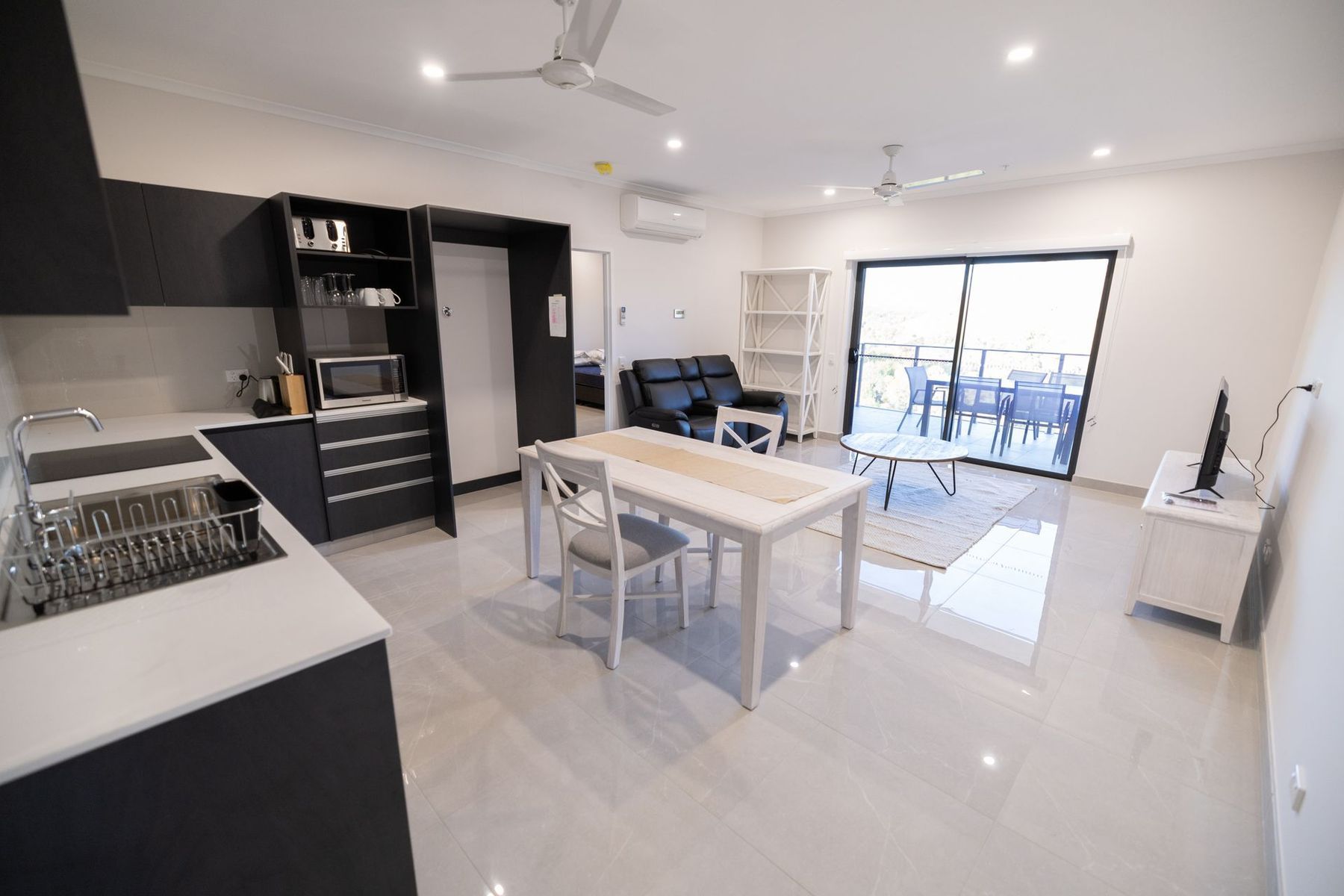 There is a Table and Chairs in the Middle of the Room  — NHM Painting & Projects in Ciccone, NT