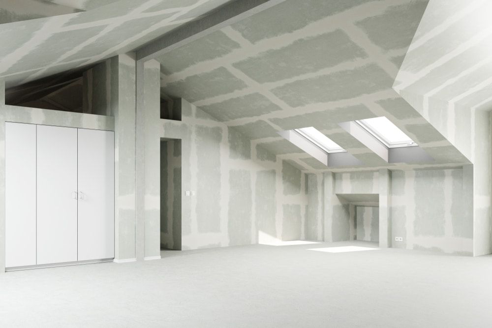 An Empty Room With White Walls and a Skylight in the Ceiling — NHM Painting & Projects in Ciccone, NT