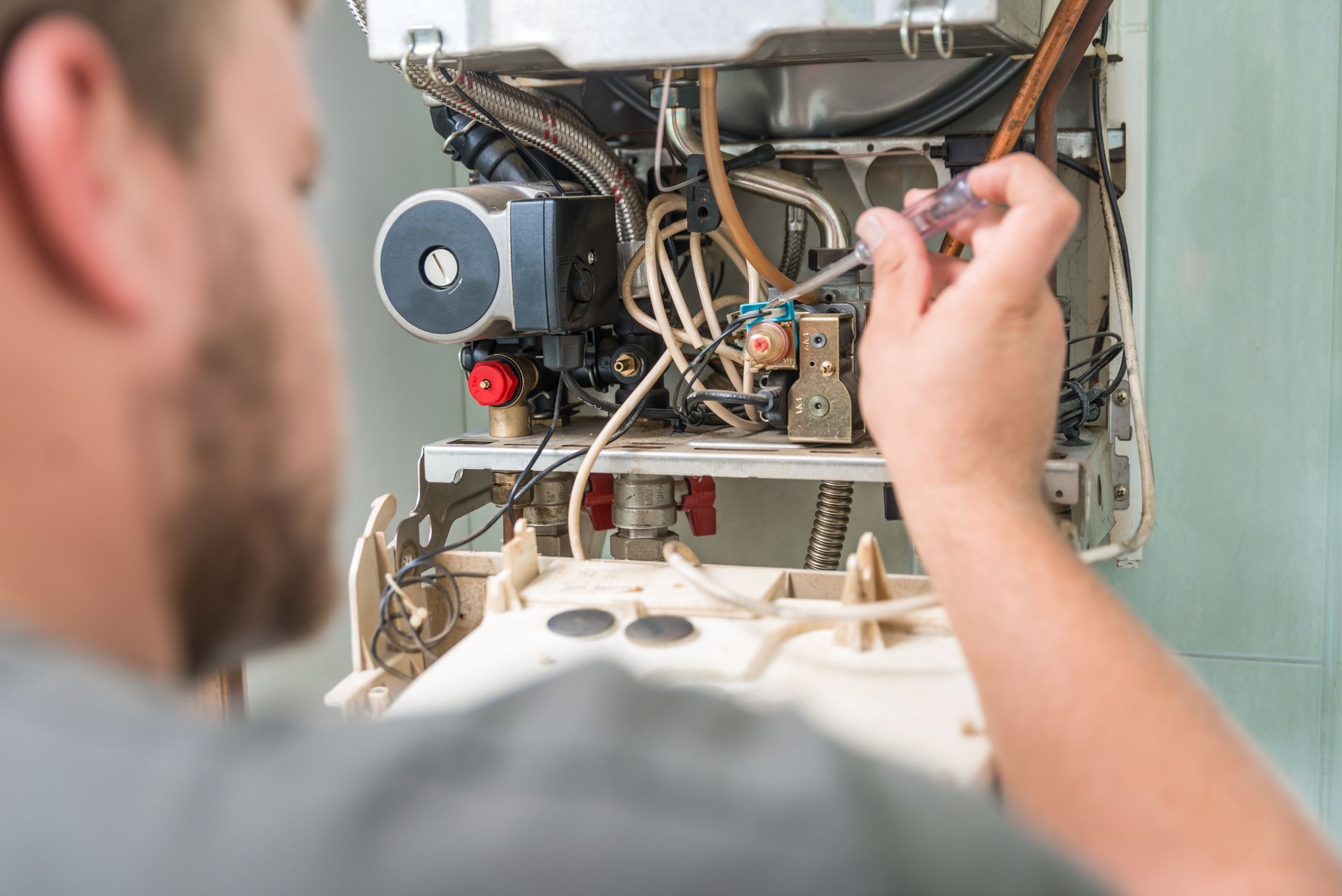 Technician repairing furnace to ensure efficiency and safety by trusted furnace repair experts in Lo