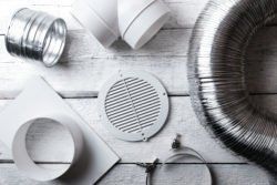 Climate Change — Amherst, OH — Energy 1 Heating & Air Conditioning There are many different types of ducting on the table.