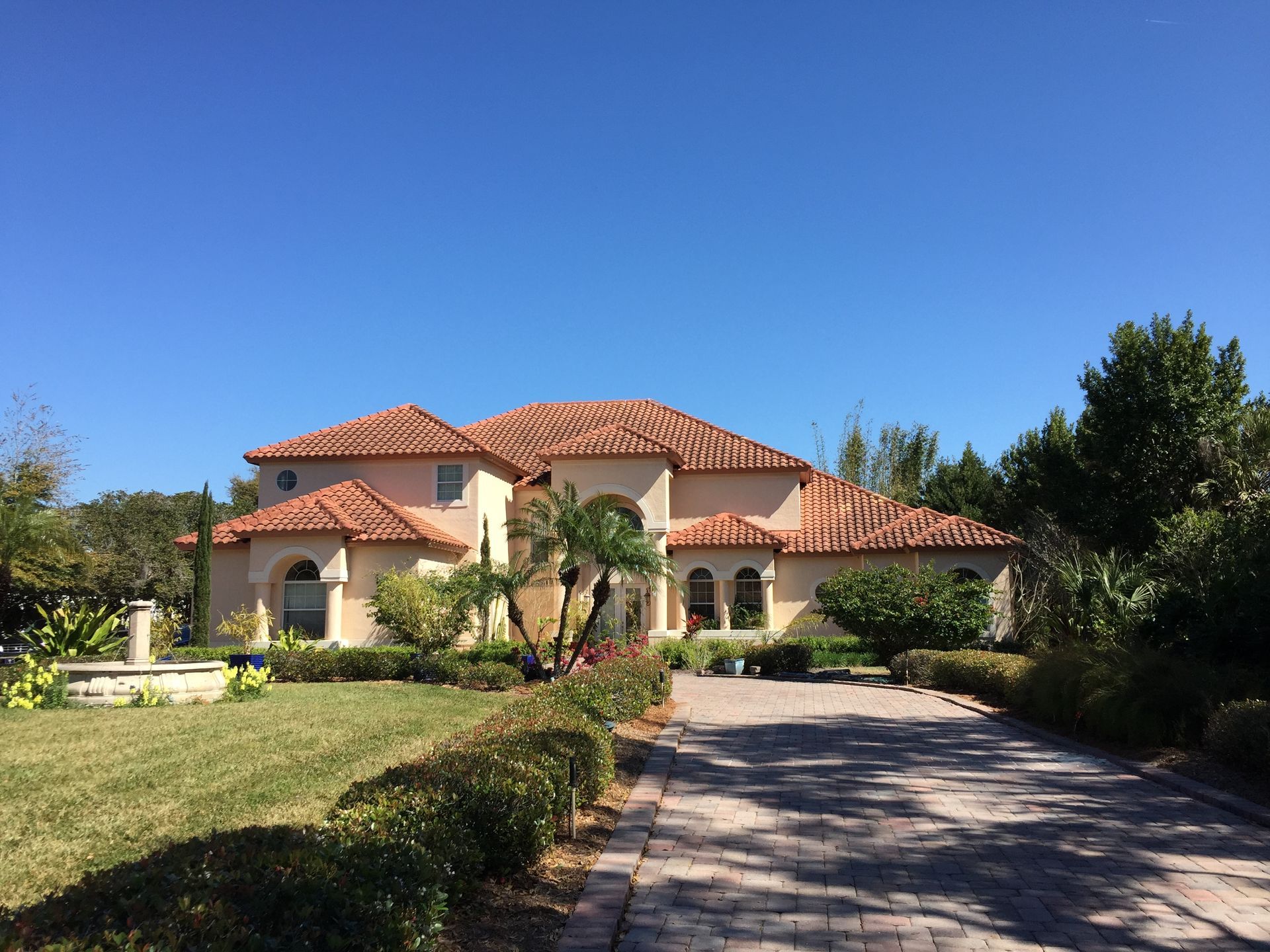 A large house with a driveway leading to it