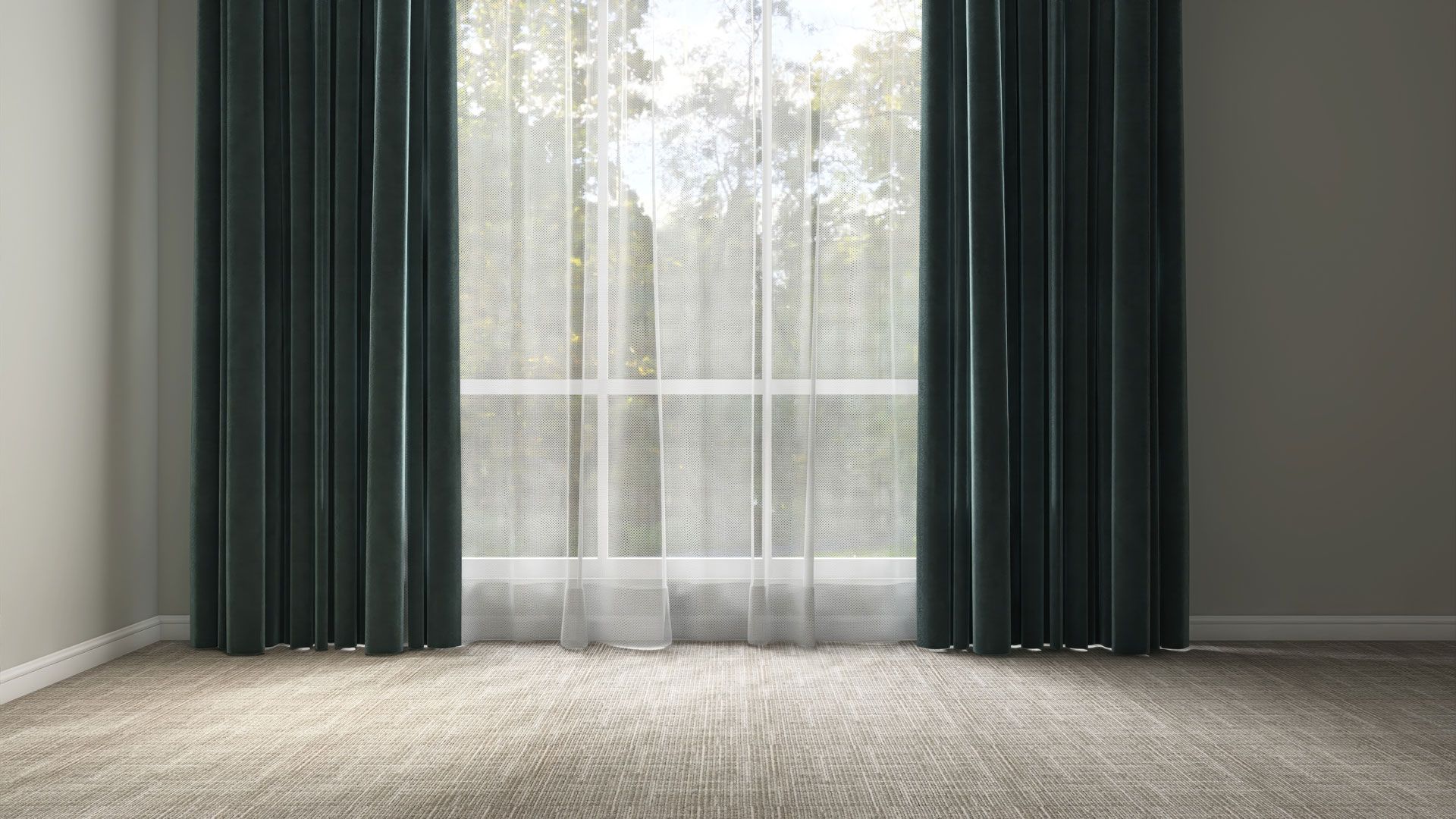 Empty room with dark green curtains and sheer drapes over a bright window, light carpeted floor