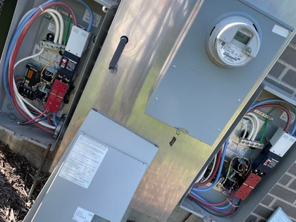 Electrical switch with multiple terminals, a red switch, and indicator lights.