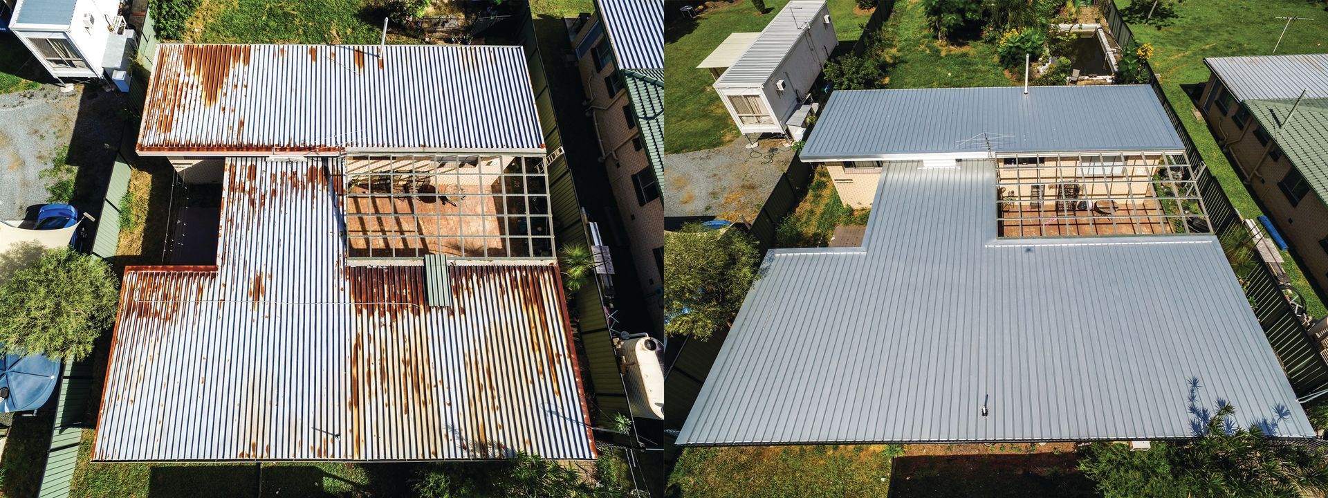 Aerial view of two houses with large silver roofs, one partly under construction amid trees.