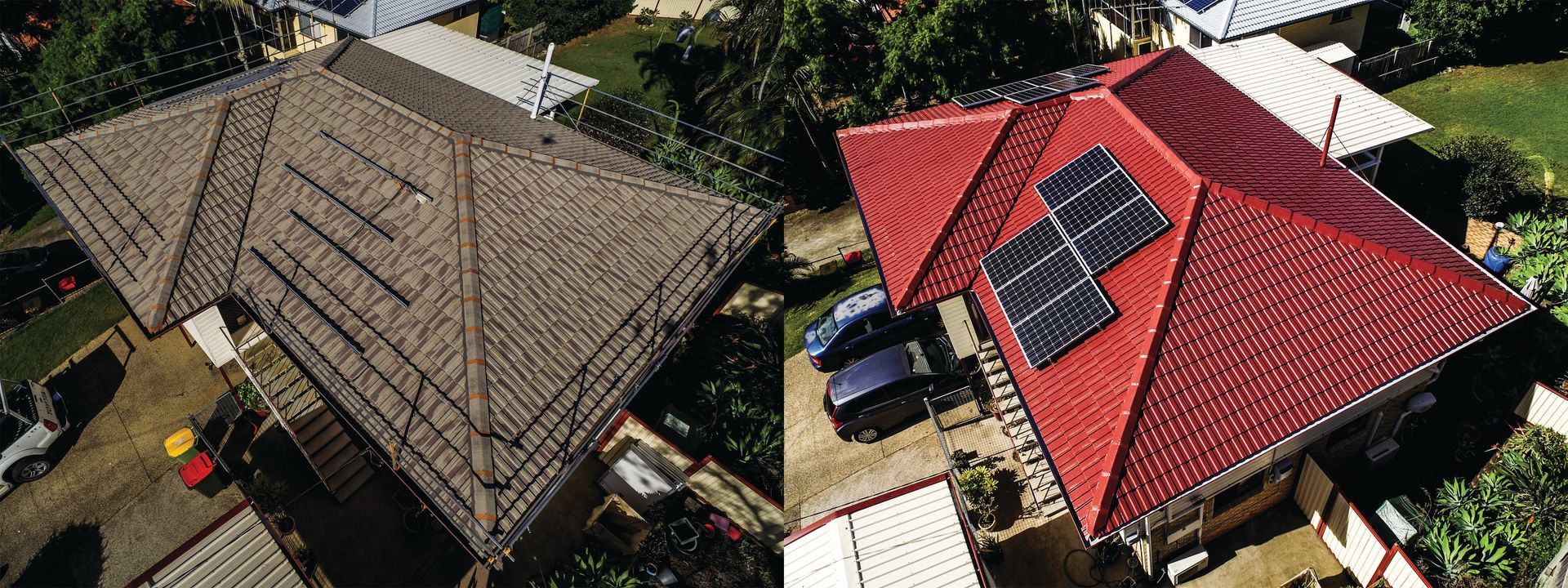Aerial view of two houses with dark roofs, one with red roof panels and solar panels on top.