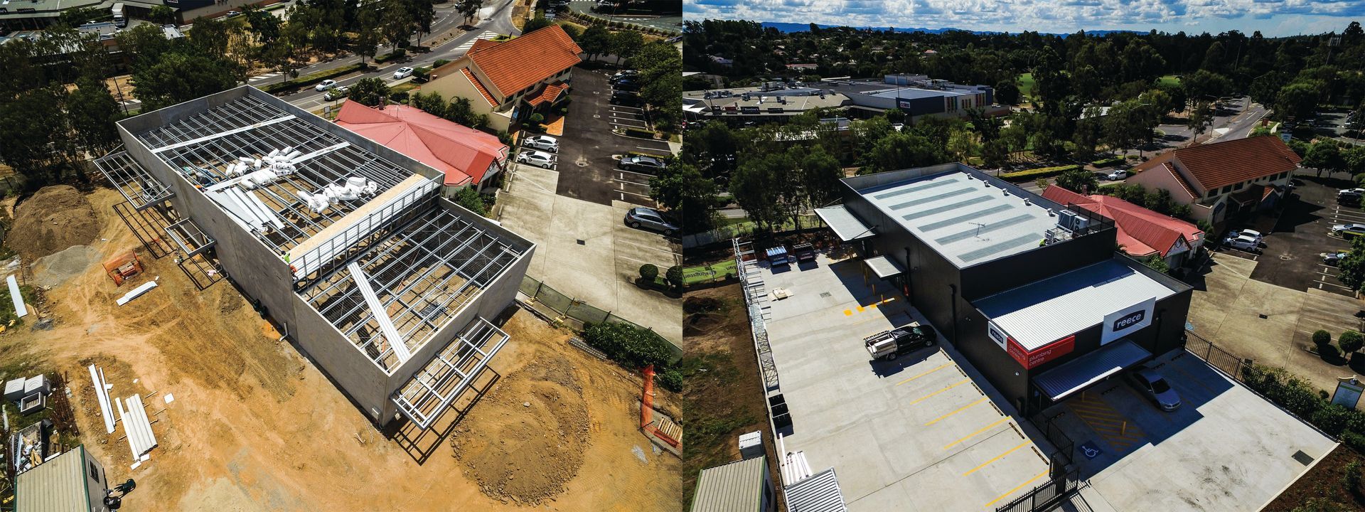Aerial view of a construction site beside modern buildings and trees.