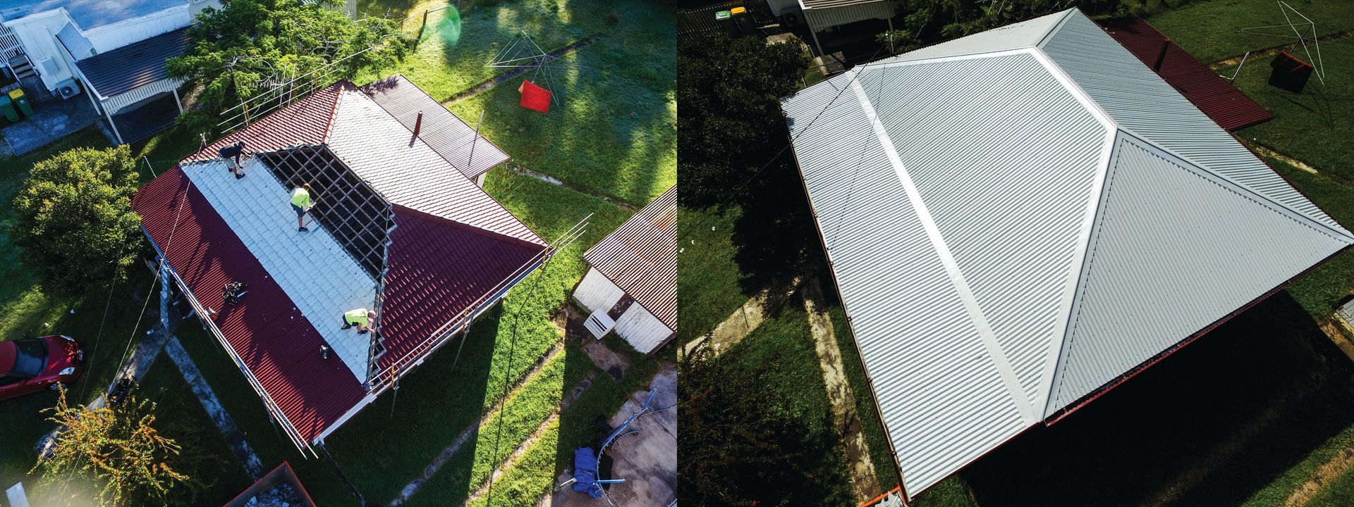 Aerial view of two house roofs, one red and one gray, with trees and a driveway between them