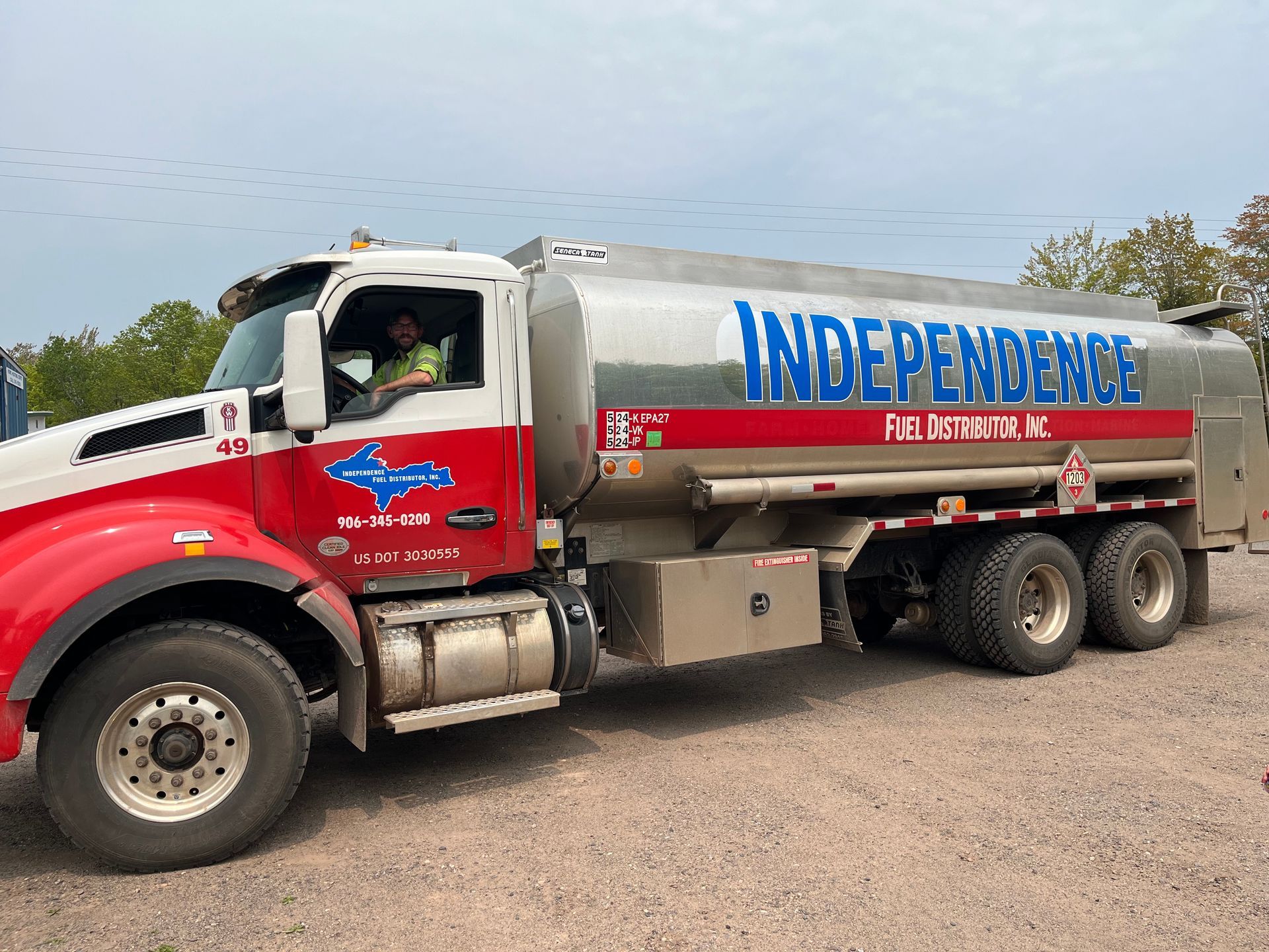 Fuel tanker truck on an airport tarmac, labeled 