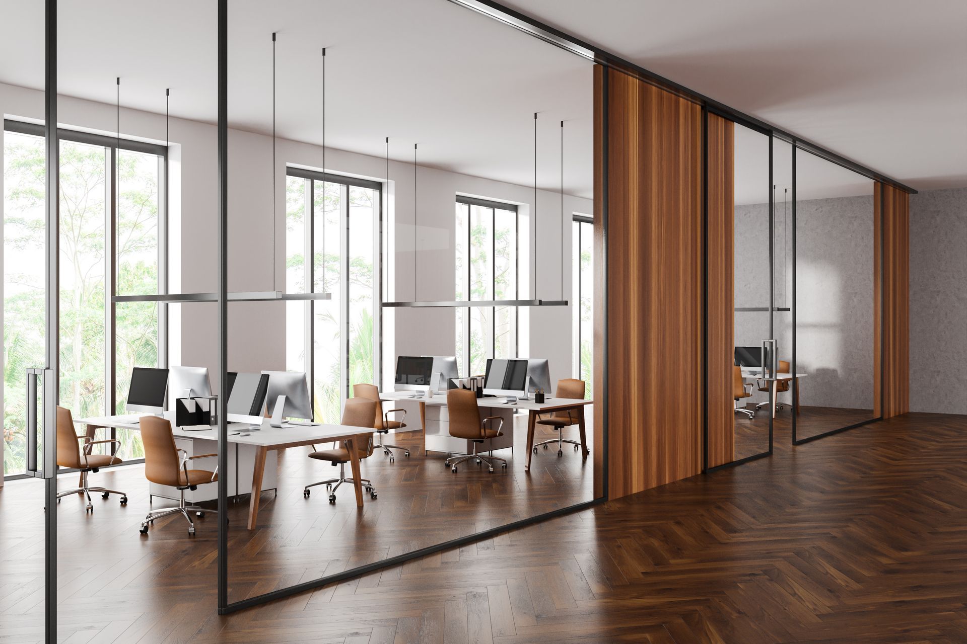 Modern open-plan office with desks, chairs, large windows, and a wood slat partition
