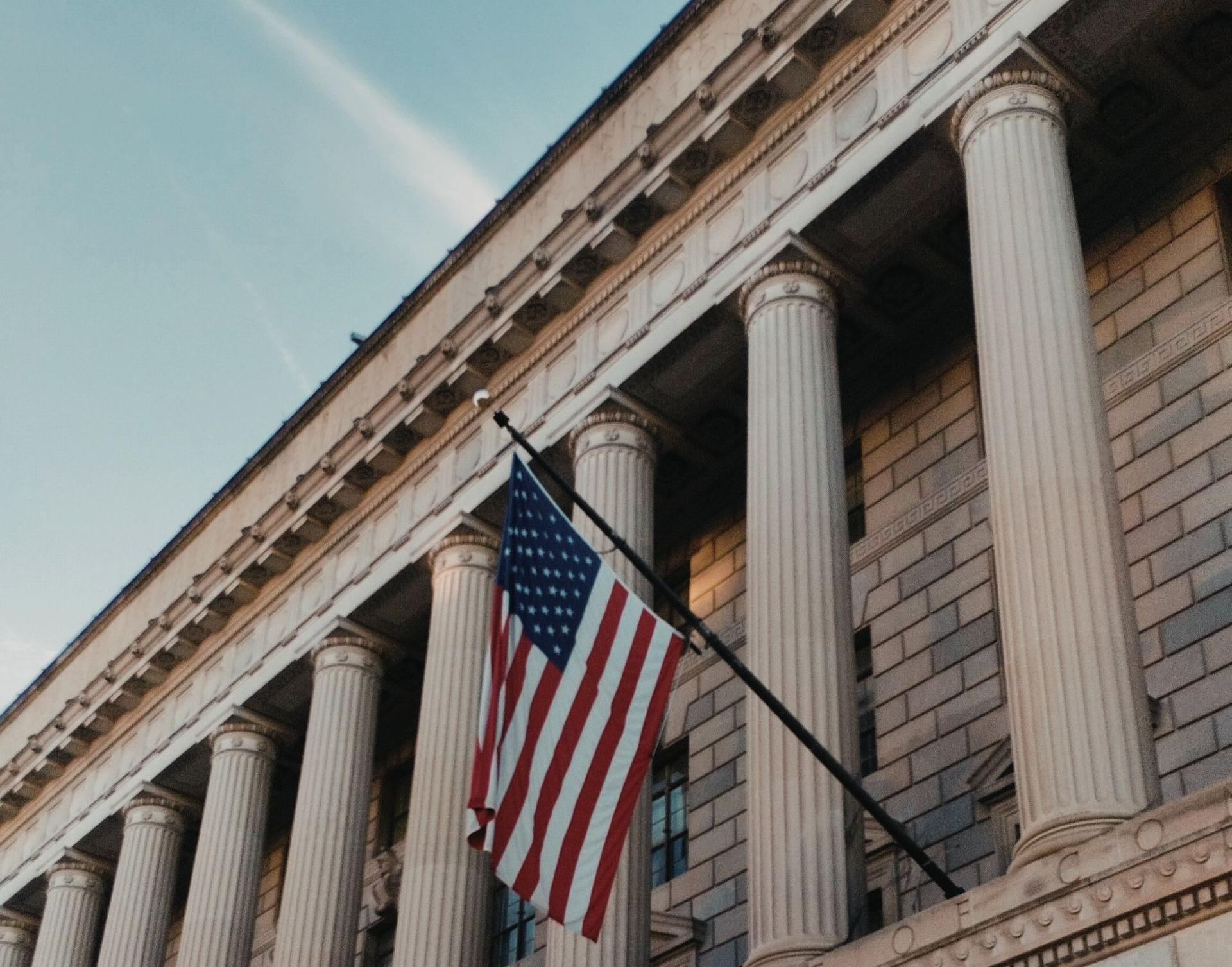 Government building with American Flag.