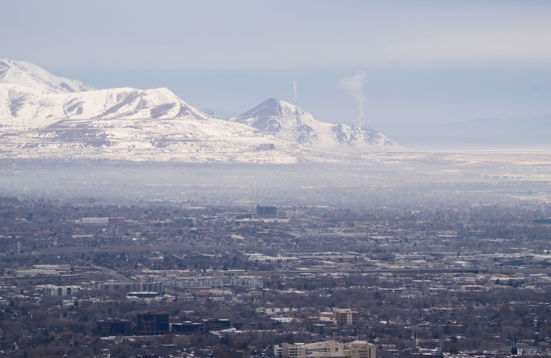 Salt Lake City with a layer of air pollution/inversion over it.